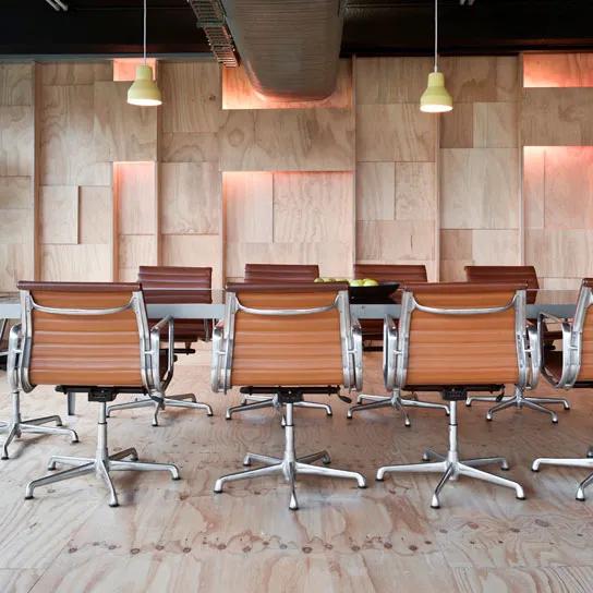 Modern office space featuring multiple desks and chairs