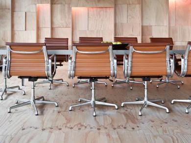 Modern office space featuring multiple desks and chairs