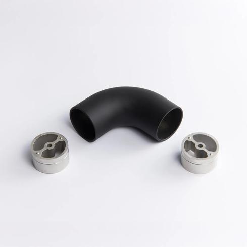A fixed 90 degree black metal tube connector positioned between two silver circular mounting inserts 65mm x 43mm
