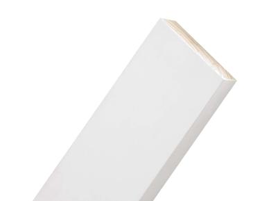 Close-up of a primed pine timber board angled against a white background