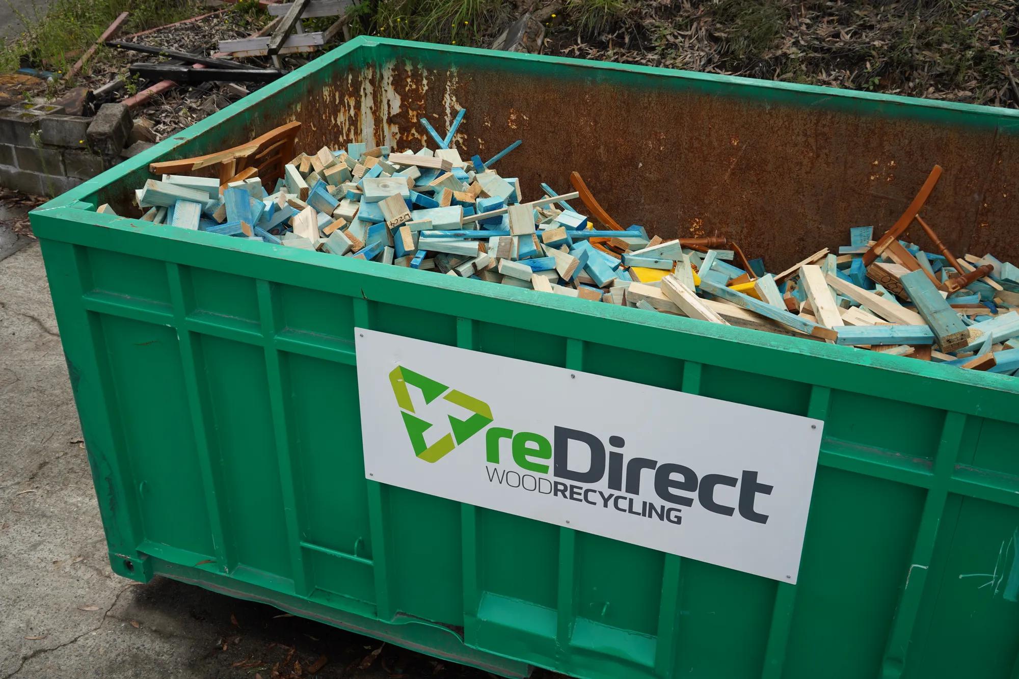 reDirect Wood Recycling bin filled with blue-painted frame and truss timber.