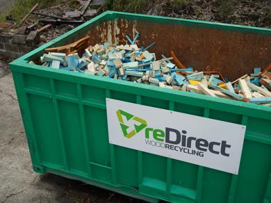 reDirect Wood Recycling bin filled with blue-painted frame and truss timber.