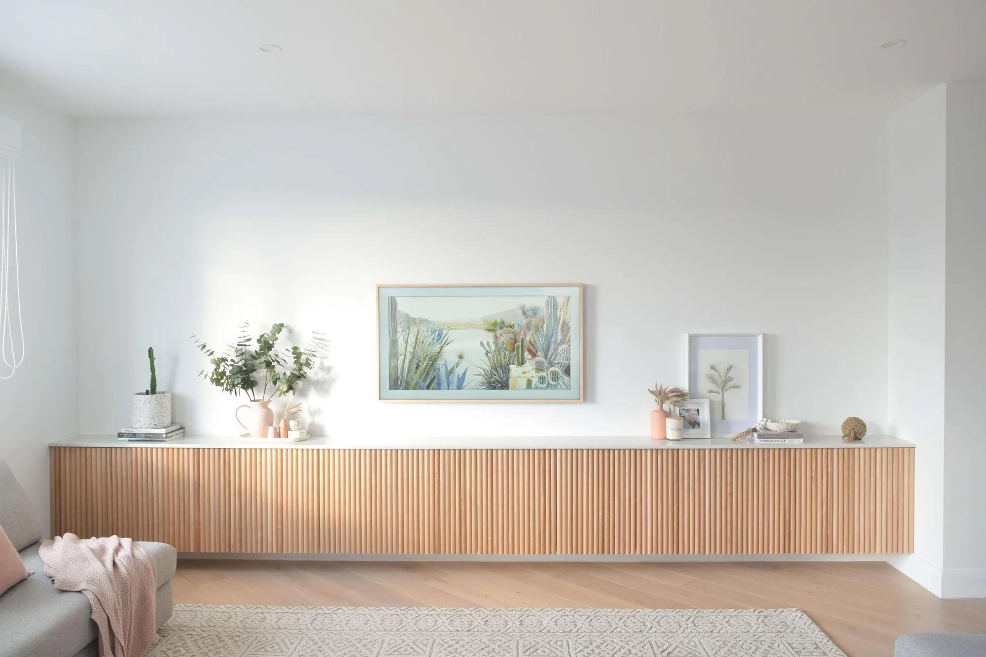 Long, rectangular wooden cabinet in a room against a white wall