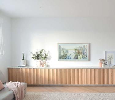 Long, rectangular wooden cabinet in a room against a white wall