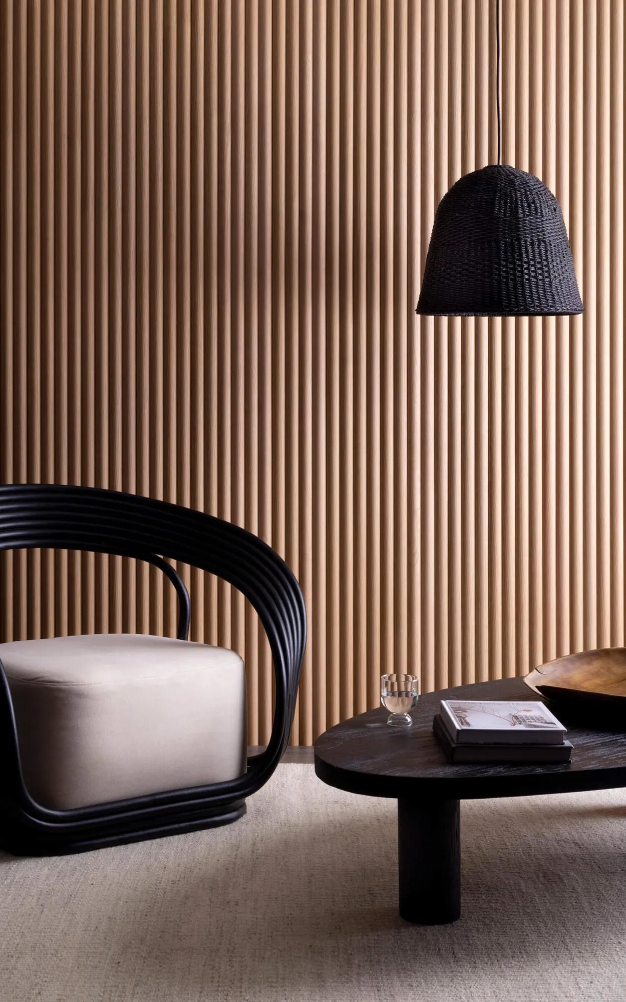 A wall in a room with panels of wood