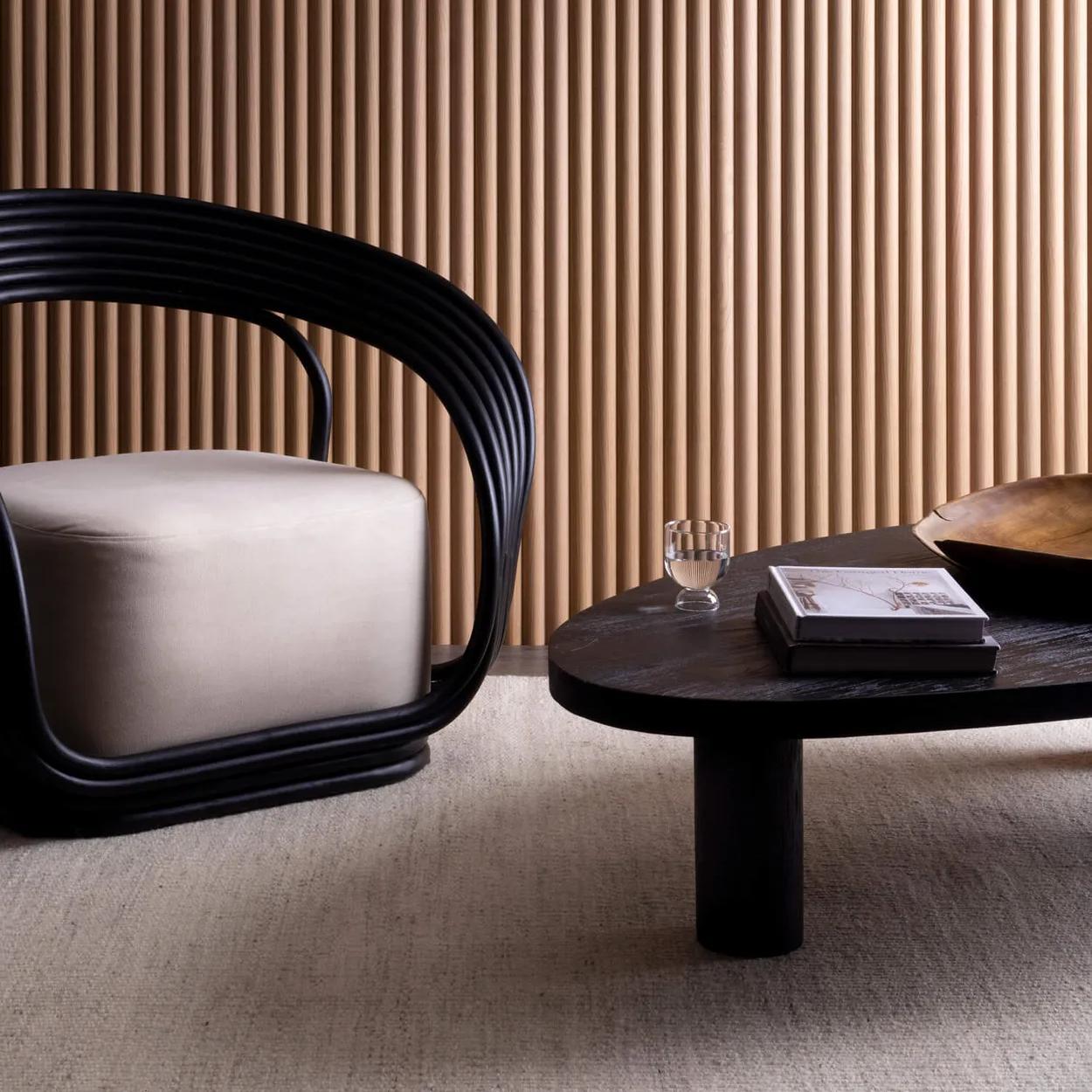 A wall in a room with panels of wood