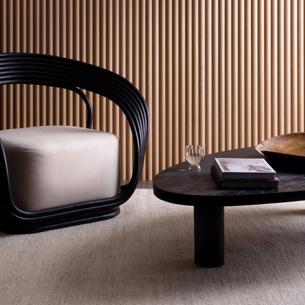 A wall in a room with panels of wood