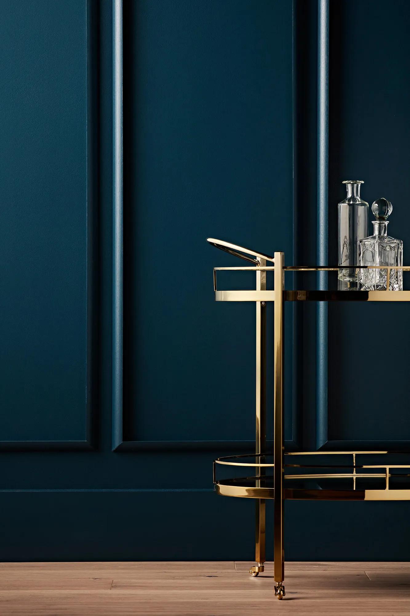 Modern bar cart in a dark room